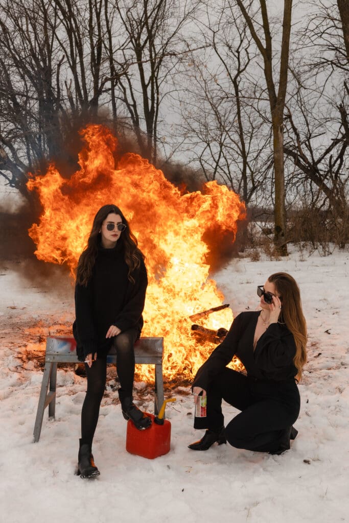Creative fire photography portrait session with female model in winter snow in Wisconsin