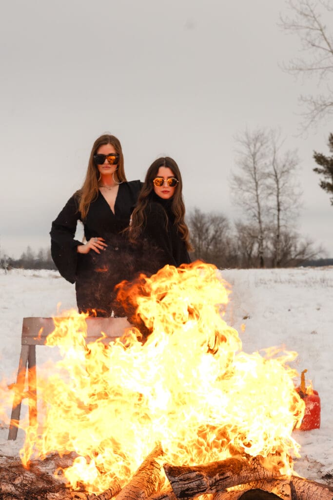 Creative fire photography portrait session with female model in winter snow in Wisconsin